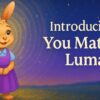 An illustrated bunny named Luma stands in a sunlit field as glowing ripples radiate outward, symbolizing belonging and the message “You matter.”